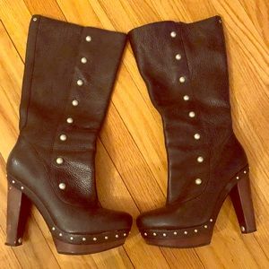 Authentic supple black leather platform UGG boots.